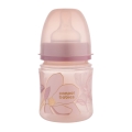 Różowa butelka Canpol babies EasyStart 120ml GOLD z przezroczystą zatyczką i kwiatowym wzorem, lekka i bezpieczna butelka antykolkowa dla niemowląt.