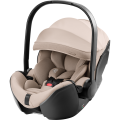 Fotelik samochodowy Britax Römer Baby-Safe Pro w kolorze beżowym style Teak, z miękką tapicerką i regulowaną rączką