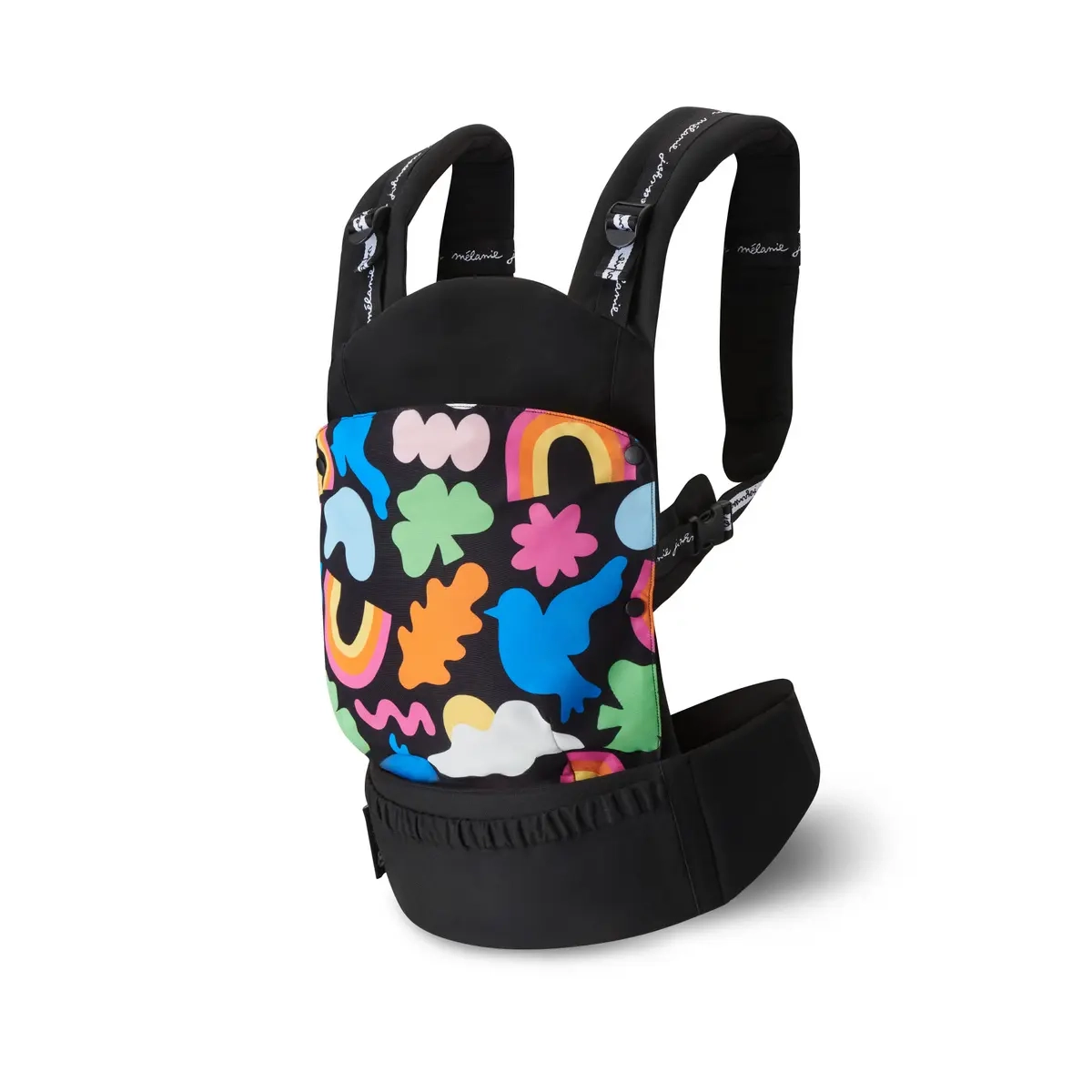 Boczne ujęcie nosidełka HUGGY Happy Shapes ukazuje nowoczesny design i solidne wykonanie. Kolorowy panel wyróżnia produkt na tle innych, a szeroki pas biodrowy gwarantuje wygodę noszenia.
