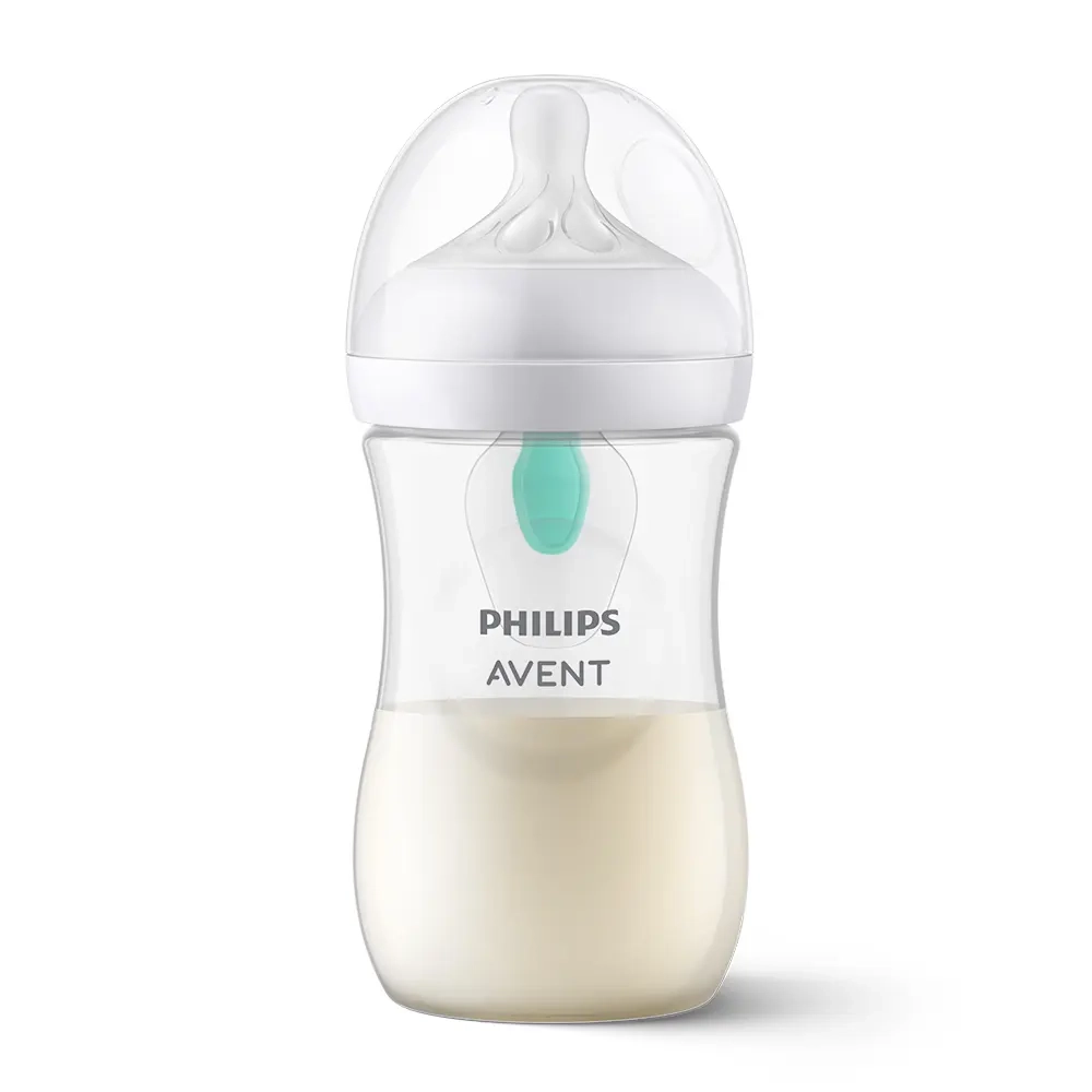 Butelka Philips Avent Natural Response z systemem AirFree 260 ml, przezroczysta z białą nakrętką i smoczkiem, częściowo wypełniona mlekiem, przeznaczona do naturalnego i antykolkowego karmienia niemowląt