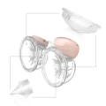 Zestaw Babyono 1002 Twinny KIT I części zamiennych – membrana i zaworek pokazane przy laktatorze TWINNY jako elementy do wymiany.