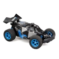 Zdalnie sterowany samochód Exost PRO Rocket One, czarno-niebieski buggy terenowy z dużymi oponami.