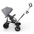Kinderkraft Aston 2 Plus rowerek trójkołowy z budką przeciwsłoneczną, barierką ochronną i prowadnikiem dla rodzica.